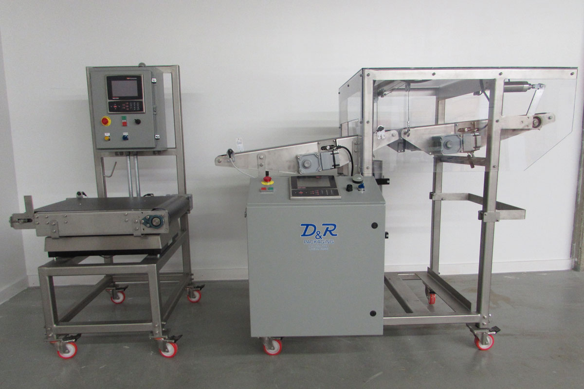 Intermittent Motion Case Checkweigher and an In Motion Poly Bag Checkweigher Featured Image